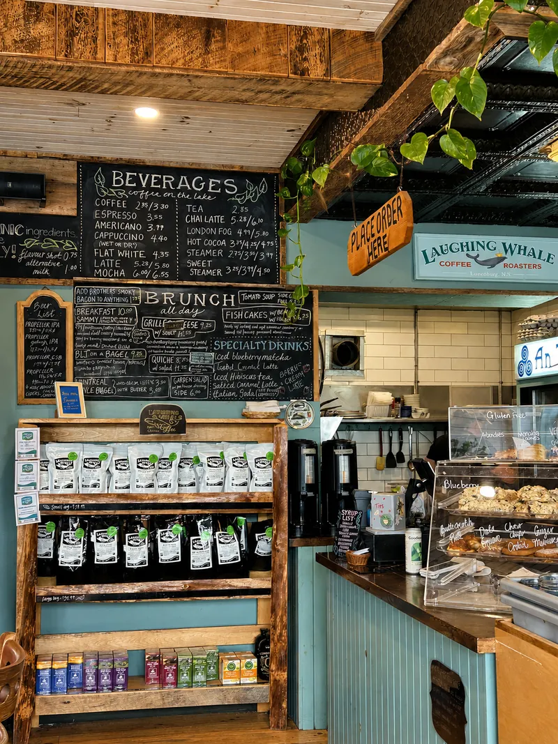 The blue counter, coffee shelves and handwritten menu boards inside Cottage Cafe.